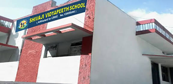 The school building seen from the road